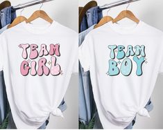 "💙 Get ready for the ultimate gender reveal celebration with our Retro Gender Reveal Shirt! This trendy T-shirt is perfect for the whole family and features \"Team Boy\" and \"Team Girl\" designs. Whether you're hosting a baby shower or want to add excitement to your gender reveal, our versatile and stylish Gender Reveal Group Shirt is a must-have. Grab yours now and let the anticipation begin! 👕 PRODUCT INFO The Bella + Canvas shirts are super soft and comfy! These t-shirts are made of light fabric and have ribbed knit collars to bolster shaping. They are extremely durable, and will withstand years of repeat washing and wearing. Shoulders, sleeves, and hems have taping for better fit over time. ✏️ DESIGN Designs are printed onto the shirt using Direct to Garment (DTG), which means the i Pink Pre-shrunk T-shirt For Gender Reveal, White Short Sleeve Tops For Gender Reveal, Cotton Graphic Tee For Gender Reveal, Pink Crew Neck T-shirt For Gender Reveal, White Short Sleeve T-shirt For Gender Reveal, White Short Sleeve Shirt For Gender Reveal, Cute T-shirt With Funny Print For Gender Reveal, Pink Letter Print T-shirt For Gender Reveal, Pink Graphic Tee For Gender Reveal