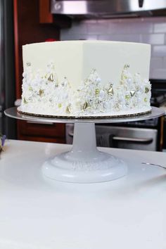 a white cake sitting on top of a table