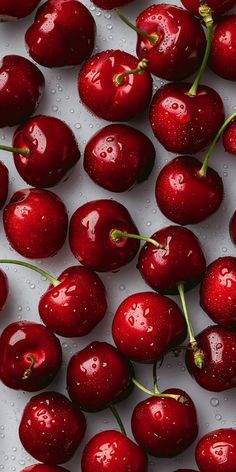 many cherries with water droplets on them