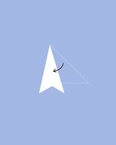 a white paper airplane flying through the sky with an arrow in it's center