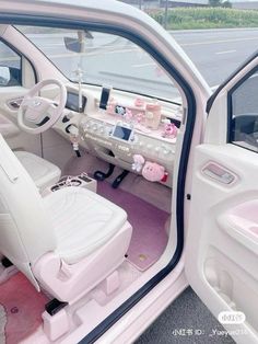 the interior of a white car with pink carpeting and accessories on it's dash boards