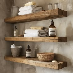 two wooden shelves filled with bathroom items