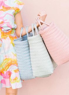 Our Maisy Totes are our favorite catch-all totes! Perfect for the beach, market, running errands, vacation and more. 100% Handwoven Environmentally Durable Plastic Handmade by talented women artisans in Bali, and sustainably sourced with care. Each POPPY + SAGE bag comes with our signature linen dust bag, a premium added touch to protect your bag while traveling or storing. Bag dimensions: 11"W x 15"H x 10"D HANDMADE ARTISAN BAGS All of our rattan straw items are handwoven by individual artisans Pink Summer Bucket Bag For Everyday, Eco-friendly Pink Beach Bag For Everyday Use, Pink Beach Bag For Everyday Use In Spring, Pink Eco-friendly Tote Beach Bag, Eco-friendly Pink Tote Beach Bag, Pink Summer Bucket Bag For Shopping, Pink Handwoven Bucket Bag For The Beach, Everyday Pink Straw Bag With Braided Handles, Pink Straw Bag With Braided Handles For Everyday