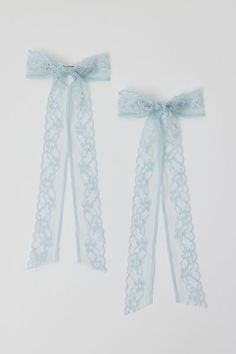 Mid-sized hair barrettes topped with oversized bows crafted from sheer lace. Sod in a set of two. Content + Care. Set of 2 Textile, mixed metal Spot clean Imported Blue Accessories For Women, Blue Outfit Accessories, Blue Accessories Aesthetic, Lace Bow Aesthetic, Nylon Hair Bow, Blue Hair Ribbon Aesthetic, Light Blue Accessories, Inking Reference, Light Blue Jewelry