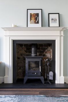 a fireplace with an old fashioned stove in it