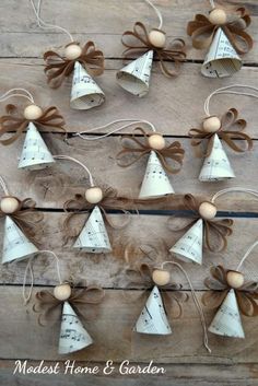 some bells are hanging on a wooden board