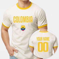 Custom Soccer Ringer T-Shirt Front-Back Print, Personalized Ringer Football Team Shirt, Colombia Short Sleeve Soccer Tee, Sports Gifts. 4.5 oz./yd², 100% ring-spun USA cotton, 30 singles Reactive-dyed for longer-lasting color Pre-washed to minimize shrinkage Contrast ribbed binding on neckline and sleeves Taped neck and shoulders Double-needle stitching on neck and bottom hem Tear away label Custom Soccer Ringer T-Shirt Front-Back Print, Personalized Ringer Football Team Shirt, Colombia Short Sl Yellow Crew Neck T-shirt For Sports Season, Yellow Short Sleeve T-shirt With Name Print, Yellow Crew Neck Top For Sports Events, Yellow Crew Neck Top With Team Name, Yellow Crew Neck T-shirt For Sports Events, Football Team Shirts, Soccer Teams, Soccer Tees, Team Shirt