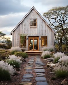 a house with stone pathway leading to the front door