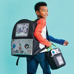 Nylon material with metallic and confetti Outside zippered compartments 1 inside pocket and 2 outside side pockets Adjustable padded shoulder straps Lined 12 1/2" w x 18 1/2" h x 5 1/2” d Backpacks For Boys, Boys Backpack, Tablet Pillow, Bear Halloween, Mom Accessories, Sour Patch Kids, Boys Bottoms