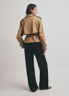 The timelessness of The Charles Trench will make it the most chic and classic article of clothing in your closet. Our latest rendition has a cropped length, cut from a cotton-blend gabardine with a slightly boxy silhouette and cinchable waist belt. The double-breasted style is finished with faux horn buttons and contrast stripe lining. 97% COTTON 3% ELASTANECARE INSTRUCTIONS:Dry clean onlyGaby is 5'9" wearing size Small Khaki Cotton Cropped Jacket For Work, Chic Cotton Cropped Jacket For Work, Chic Khaki Cropped Jacket For Work, National Daughters Day, Heel Accessories, Daughters Day, Favorite Daughter, Denim Flares, Fashion Books