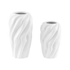 two white vases sitting next to each other on a white surface with wavy lines