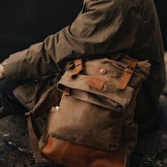 "The 'Mighty Taw' backpack features rigid handmade heritage waxed canvas and reclaimed leather which aids in maintaining its rugged appearance. The Taw is our largest-capacity backpack and as rugged as it looks. Heritage style waxed cotton and reclaimed leather backpack featuring a vintage look and contemporary purpose. Even when full it's sleek thanks to a deep interior with a protective laptop compartment. The roll-top hood shouts vintage rucksack, while magnetic fasteners on leather straps give it contemporary practicality. Two outer zipper compartments and quick-access side pockets add further storage versatility. Waxed to protect it against moisture, the Taw is a great lifestyle companion with an emphasis on 'life' and 'style'. This backpack has a huge capacity, suitable for weekend t Rugged Waxed Canvas Bag For Outdoor Activities, Rugged Bag With Waxed Finish For Outdoor Activities, Rugged Leather Patch Bags For Outdoor Activities, Everyday Leather Backpack With Canvas Lining, Waxed Canvas Bags With Leather Patch For Outdoor, Outdoor Waxed Canvas Bags With Leather Patch, Leather Backpack With Waxed Finish For Outdoor Activities, Leather Backpack With Waxed Finish For Outdoor, Rugged Canvas Backpack For Everyday