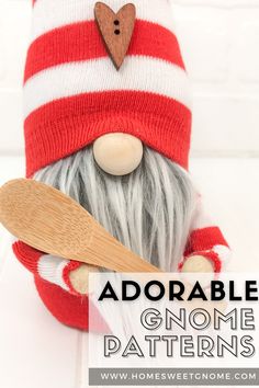 an adorable gnome is holding a wooden spoon and wearing a red striped knitted hat