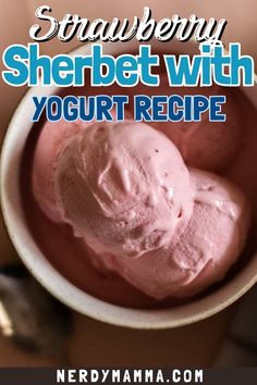 a bowl filled with pink ice cream on top of a table