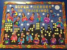 a bulletin board with superheros in training written on it