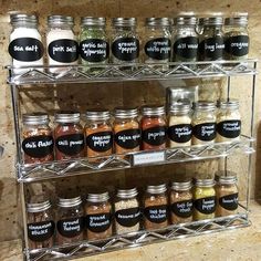 the spice rack is filled with many different types of spices