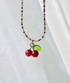 "Gold Cherry Necklace, Cherry Charm Necklace, Dainty Petite Cherry Chain, Red Cherry Chain, Fruit Necklace, Cute Fun Cherries Necklaces, Gift" Add a touch of whimsy and elegance to your jewelry collection with our Dainty Gold Cherry Necklace. Crafted with care from high-quality titanium steel and delicately plated with 18K gold, this necklace exudes charm and sophistication. The centerpiece of this necklace features two petite cherries, symbolizing sweetness and abundance. Each cherry is meticul Dainty Red Charm Necklaces With Adjustable Chain, Gift Red Beaded Chain Necklace, Red Beaded Chain Necklace Gift, Red Pendant Necklace With Chain, Red Beaded Chain Necklace For Gift, Red Chain Necklace With Lobster Clasp As Gift, Red Necklace With Delicate Chain For Gift, Red Chain Charm Necklace For Gift, Red Necklace With Delicate Chain As Gift