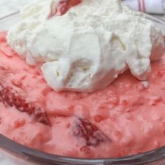 a bowl filled with ice cream and strawberries