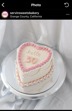 a heart shaped cake sitting on top of a plate