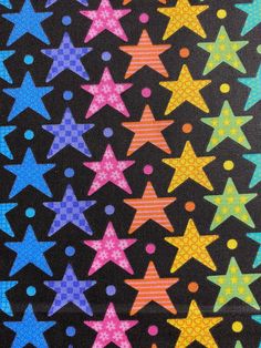 colorful stars on black background with polka dots