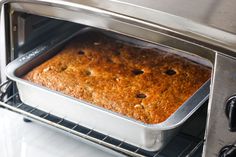 a cake baking in an oven on the rack