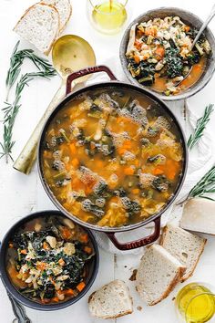 two pans filled with soup and bread on top of a table