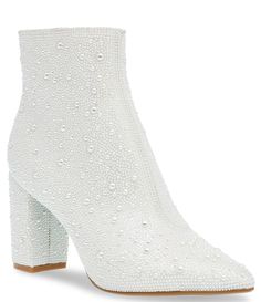 From Blue by Betsey Johnson, the Cady Faux Pearl Embellished Block Heel Booties feature:Synthetic upper with allover faux pearl detailsSide zipper closureFabric liningSynthetic outsoleApprox. 5.5" shaft heightApprox. 3.25" heel heightImported. Betsey Johnson Pearl Boots, White Heels Prom Sparkle, Ankle Boots Bride, Wedding Reception Boots, Winter Wedding Shoe, Betsey Johnson Bridal Shoes, White Rhinestone Boots, White Sparkly Boots, Betsy Johnson Glitter Booties Outfit