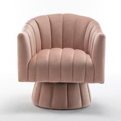 a pink chair sitting on top of a white floor