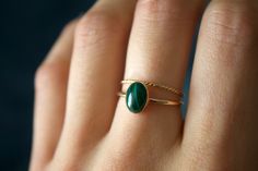 STUNNING handmade Malachite ring set✨ * Listing covers both the malachite ring and twisted band.  Due to each stone being natural, each stone will vary in color, design, and clarity Beautiful 8x6mm natural oval Malachite gemstone ✨ Malachite is a green copper carbonate mineral. It is part of the monolithic crystal system and has a silky luster. Malachite is often used as an ore of copper. It has an opaque transparency and sometimes has a patterned surface. Malachite is a rich shade of green and its meaning is transformation and positive change. This gem was loved by the Greeks and the Egyptians, and used as a protective gem from curses and negative energies.  It is a stone that takes its name from the Greek word for malakos - meaning soft. While it is a stone that holds its strength, Malac Minimalist Jewelry Gold, Gold Minimalist Jewelry, Schmuck Gold, Malachite Ring, Malachite Rings, Crystal System, Twisted Band, Gold Filled Ring, Green Copper