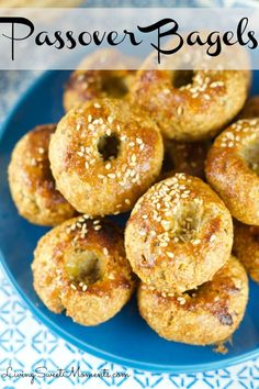 a blue plate topped with mini donuts covered in sesame seeds