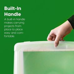 a hand is holding onto a plastic container