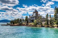 a large house sitting on top of a lake