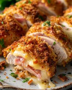 some food on a white plate with parmesan cheese and bread crumbs