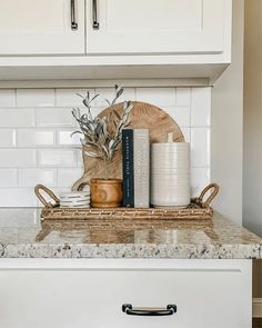 a kitchen counter with some books on top of it and a basket in the middle