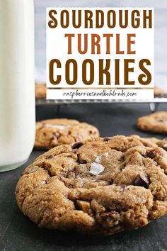 a chocolate chip cookie next to a glass of milk with the words sourdough turtle cookies on it