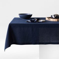 a table with a bowl and napkins on it