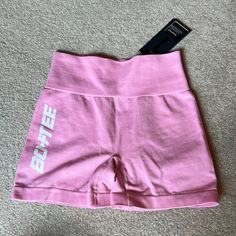 Pink Bo+Tee Short Workout Shorts Pink Crop Sporty Tops, Sporty Pink Short Length Top, Sporty Short Length Pink Tops, Sporty Short Pink Tops, Short Pink Sports Top, Pink Short Tops For Sports, Pink Short Length Top For Sports, Pink Short Length Workout Top, Pink Letter Print Activewear For Sports