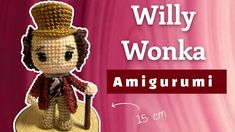 an amigurmi doll with a top hat and cane