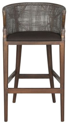 a wooden and wicker bar stool with black seat pad on an isolated white background