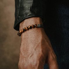 Throughout many different cultures a variety of bead types can be recognized as symbols for faith, positive energy, and healing. The Sacred bracelet offers a variety of smooth, textured, and coloured beads and stones, designed to be worn on its own or stacked with others. Handcrafted Sterling Silver. Crafted with Tiger's Eye from the Americas, Asia, and Africa.