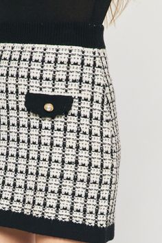 This Totally Clueless Skirt is a timeless addition to your wardrobe. Featuring a stylish black and white plaid print, this high-waisted mini skirt offers a fitted fit to hug you in all the right places. Show off the cool faux pocket detail with medallion buttons, and pair it with the matching jacket to make a fashion statement! Crafted with stretch fabric for long-lasting comfort, this cozy skirt has an 18" length from waist to hem. Look totally "clueless" and totally great! Details Black and white plaid mini skirt Fabric has stretch, fitted fit High waisted featuring faux pockets with medallion button detail Pair this cute skirt with the matching jacket Unlined Size small from waist to hem: 18" Material and Care 50% Viscose 28% Polyester 22% Nylon Hand wash, dry flat Patterns may vary Mat Chic Houndstooth Mini Skirt, White Mini Skirt With Houndstooth Pattern, Skirt Fabric, Flats Patterns, Black And White Plaid, Plaid Mini Skirt, Clueless, Cute Skirts, Hug You