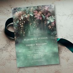 a wedding card with flowers on it and a ribbon around the bottom that says, elizabeth hudson and thomas williams