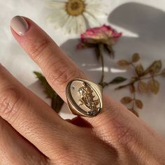 DESCRIPTION The June Birth Flower Signet Ring features one of the most famous and romantic flowers in the world, the rose. Shaped like a vintage saint charm with an intricate rose relief carving and a sparkling diamond, this statement ring is handmade just for you in Los Angeles. Show love to your favorite June baby (or yourself!) with this perfect addition to your everyday collection. Note that this piece is handmade to order. Please allow for a 3-4 week lead time as we craft this special ring. Rose Gold Signet Ring With Single Diamond For Promise, Vintage Flower Shaped Diamond Ring, 14k Gold Birth Flower Promise Ring, 14k Rose Gold Flower Ring With Birth Flower, Vintage Engraved Open Ring For Promise, 14k Gold Birth Flower Rings, Dainty Gold Diamond Signet Ring, Heirloom Rose Gold Diamond Flower Ring, Heirloom Birth Flower Jewelry