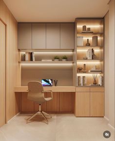 an office area with a desk, chair and bookshelf in the corner is lit by recessed lighting