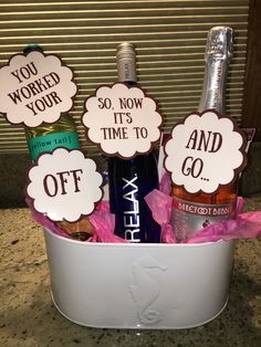 two bottles of wine in a bucket with signs