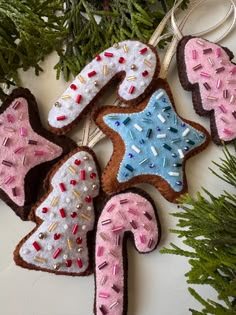 decorated cookies hanging from a christmas tree