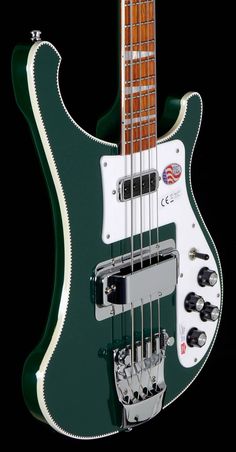 a green and white electric bass guitar