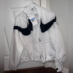 Never Worn, New With Tags! Waterproof, Has Drawstrings To Adjust The Waist And Adjustable Cuffs. Nike Casual Waterproof Windbreaker, Casual White Weatherproof Windbreaker, Nike Windbreaker, Nike White, White Nikes, Nike Jacket, Nike Women, White Black, White And Black