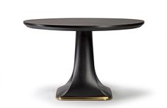 a black table with gold trim around the edges and an oval shaped top, on a white background