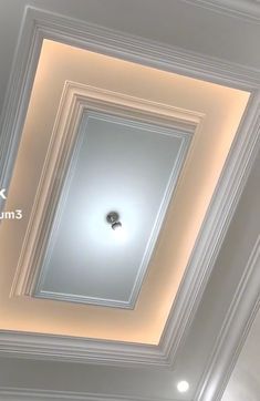 an overhead view of the ceiling in a room with white walls and trimmings